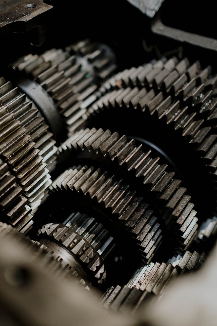 Detailed close-up of metal gears inside a machine showcasing precision engineering.